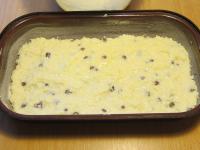 Grease a deep, narrow baking dish with butter and...