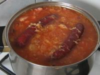 ... and put the whole sausages in the sauerkraut...