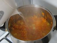 ...and pour in a hot water. Cook until potatoes...