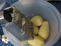 Peel the potatoes and grate them coarsely....