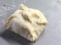 Wrap the dough around the filling and form a bun. ...