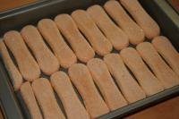Lay sponge fingers at the bottom of a deep baking...