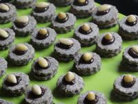Decorate the top of the rings with drop of melted...