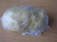 Work stiff dough from flour, walnuts, sugar, egg...