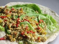 Warm the tortilla in a dry pan. Remove it from the...