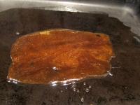 and pour a thin layer on a baking tin brushed with...