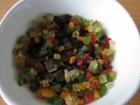 Add candied fruits into the raisins, blend and let...