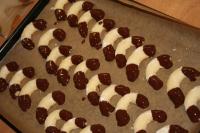 As soon as the bread rolls are done, coat them in...