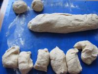 Divide the risen dough into two halves. Shape both...
