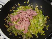 Add ham chopped into small squares into the leek...