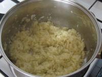 Peel the onion, cut finely and put in a pot with...