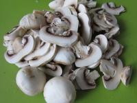 Wash the mushrooms and cut them into slices....