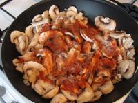 Add mushrooms to the onion, add caraway, paprika...