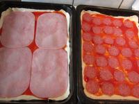 Put the ham and salami on the tomato paste....