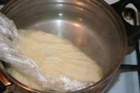 Cover the whole piece of cheese with plastic bag,...