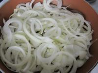 Peel the onion and cut into the rings. Saute in a...