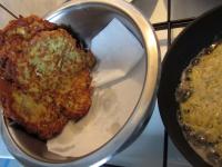 Place fried pancakes into the pot covered with...