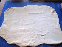 Roll out proof dough on a floured baking board....