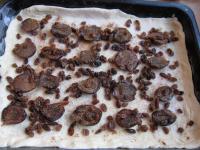 Place the dough into the tray and draw to the...