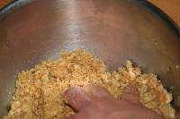 Crumble the biscuits in a food processor or use a...