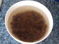 Pour the cold water over the raisins, discard the...