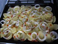 Clean the onion, cut it in rings. Divide and place...