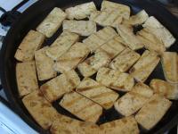 Heat the grill pan and place the tofu slices on...
