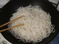 The softened noodles can be quickly fried in a wok...