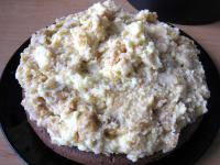 ... and spread cream on the cake base. Flatten and...