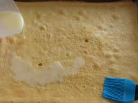 Pour liqueur on the cake base and use brush to...