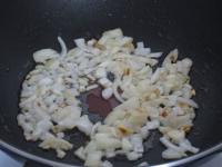 Peel the onion, cut and fry in oil....