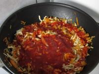 Add the tomato puree, sugar and cook for 10...