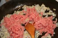 Add minced meat to the onion, sear the meat so...
