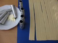 Use a rolling pin to spread part of the dough...