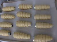 Lay trdelnicek on the baking tin lined with...