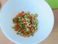 Cut the cucumber and the pepper into cubes and put...