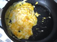 Melt a bit of butter in a saucepan, add egg with...