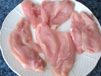 Dry washed chicken breasts and cut into 4...
