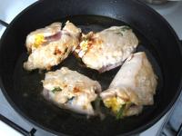 Heat the oil in the skillet. Roll the chicken...