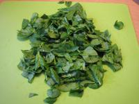 Wash spinach leaves, drain them and gently chop or...