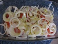 Peel the onion and cut it into wheels. Put it on...