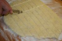 Brush the dough with beaten egg, sprinkle with...