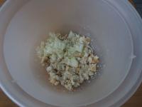 Peel onion, chop it finely and add to the bread...