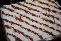 Spread whipped cream over the cream and use a fork...