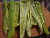 Cut the pepper, trim, wash and cut into the long...