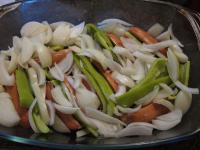 Spread remaining onion over the sausages....