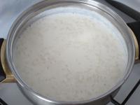 Mix the milk with water, sugar and add rinsed...