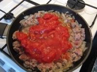 Add chopped sterilized tomatoes with tomato...