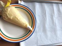 Fill decorating bag with the dough. Draw 10...