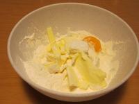 Pour in a bowl flour, sugar, add sliced butter and...